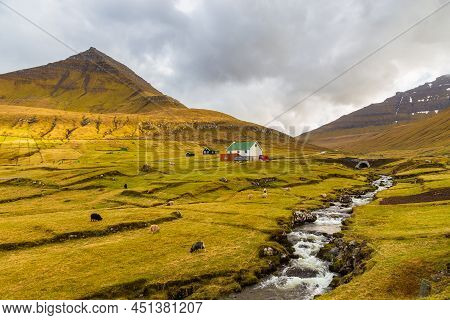 Gjogv, Faroe Islands, Denmark - 05 May 2018: Small Village Gjogv Situated On The Slope Of The Mounta