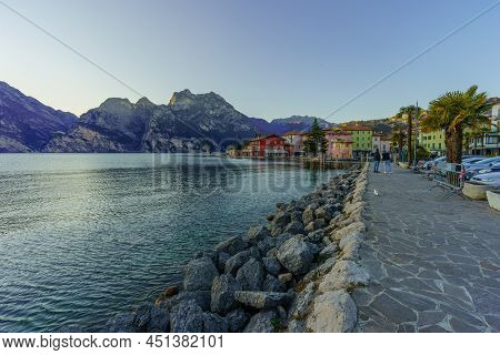 Nago-torbole, Italy - February 26, 2022: View Of The North Shore Of Lake Garda, With Locals And Visi
