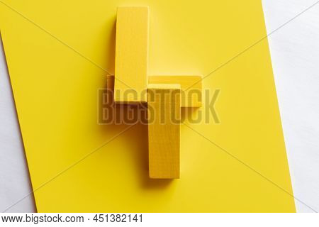Top View Of Four Tetragonal Blocks On Yellow Background.