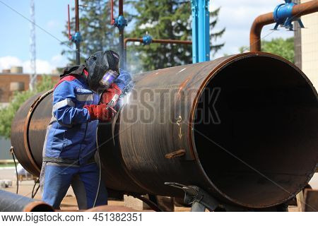 Male Welder Works. Welding Joint Of Large Diameter Pipe. High Pressure Pipe Welding For A Gas Statio
