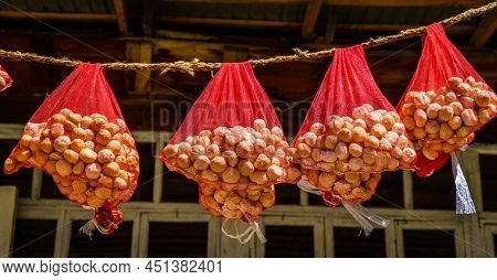Qurut - a traditional Tajik dried cheese is curing in the sun at a small village in the mountains of Tajikistan