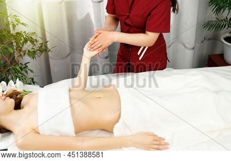 Cropped Photo Of Professional Masseur Mking To A Young Woman Client Hand Massege In Spa Salon When S
