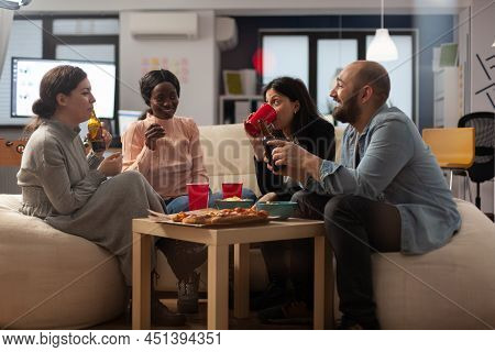 Diverse Team Of Colleagues Meeting For Drinks In Office After Work, Having Fun With Beer And Pizza S