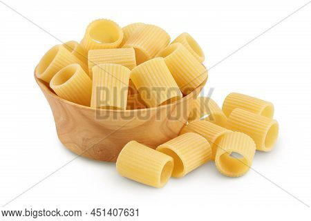 Raw Italian Pasta In Wooden Bowl Isolated On White Background With Clipping Path . Mezze Maniche Rig