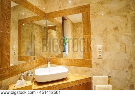 Luxury Bathroom Interior. Mirror Reflecion. Interior Design. Modern Room. White Sink. Photo Of Elega
