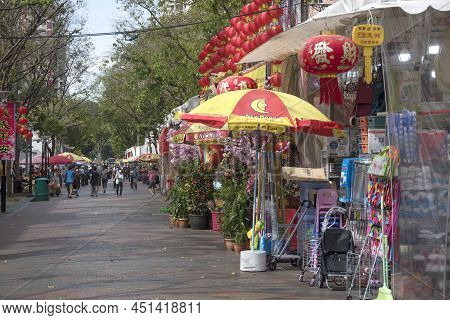Singapore- Feb 23, 2022: Stalls Selling Temple Prayer Offerings Along The Chinese Temple At Bugis In