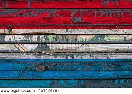 The National Flag Of Luxembourg
 Is Painted On Uneven Boards. Country Symbol.