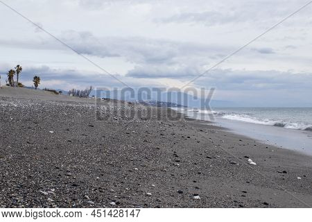 Fantastic Sea And Mountain View. Empty Beach Without People In The South Of Italy. Journey For Sprin