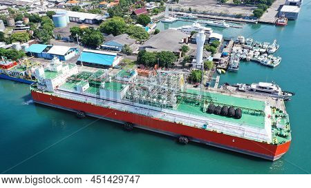 Red And White Floating Storage And Regasification Unit, Fsru, Lng-vessel In Benoa Harbour Under Ligh