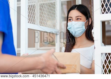 Asain Young Woman, Client Received A Delivery Of Cardboard Box, Parcel From Delivery, Postman, Weari