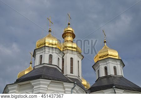 Gilded Domes Of An Ancient Orthodox Church Against The Sky.