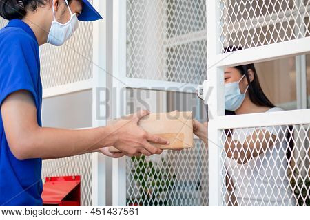 Asian Young Woman, Client Received A Delivery Of Cardboard Box, Parcel From Delivery, Postman, Weari