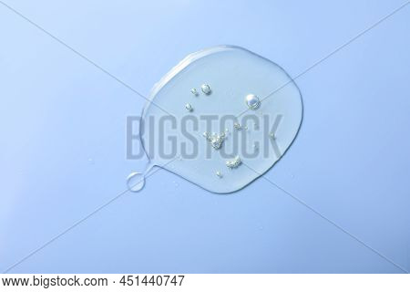 Drop Of Hydrophilic Oil On Light Blue Background, Top View