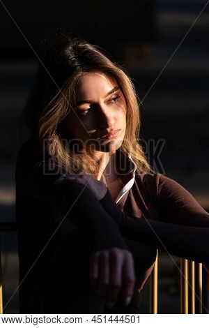 Portrait Of A Fashionable Young Brunette Woman Wearing Solid Long Sleeve Bodycon One Piece Jumpsuits