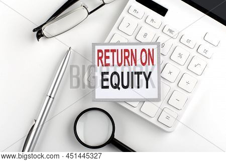 Return On Equity Text On Sticker With Calculator, Glasses And Magnifier
