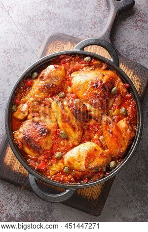 Mediterranean Chicken Baked With Tomatoes, Peppers, Onions And Garlic Close-up In A Frying Pan On Th