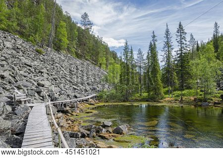 View Of The Pyha-luosto National Park In Summer, Rocks, Stones, Trees, Wooden Walkway And Natural Po