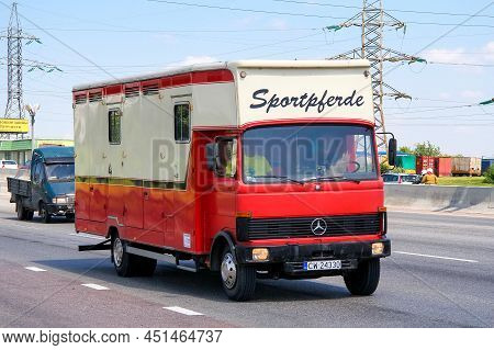 Moscow, Russia - June 2, 2012: Red Horse Carrier Van Mercedes-benz Lk 813 At An Intercity Road.