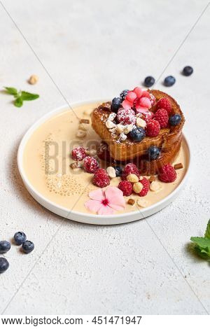 Ring Rum Baba With Lime And Basil And Raspberries On Light Background