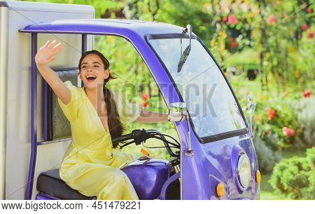 Smiling Amazed Young Woman Draver In Electro Car. Saving Ecology. Electric Cars.