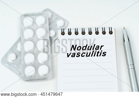 Medicine And Health Concept. On A Brown Surface Lie Pills, A Pen, A Stethoscope And A Notebook With 