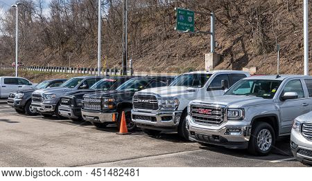 Monroeville, Pennsylvania, Usa March 20, 2022 Used Trucks For Sale Lined Up At A Dealership On A Sun