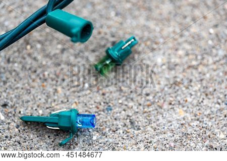 Focus On Replacement Bulb For A String Of Christmas Lights To Repair A Dud.