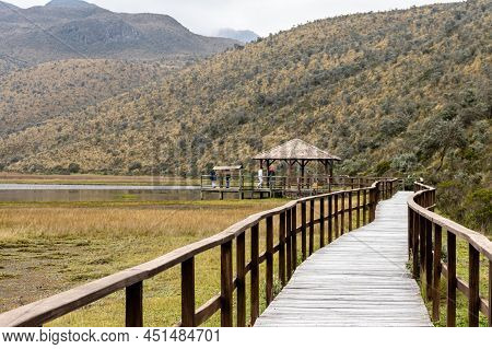 Cotopaxi National Park. Observation Deck And Wooden Walkway At Lake Limpiopungo On An Overcast Rainy