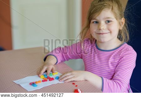Little Creative Toddler Girl Making Colorful Giraffe With Playmais. Active Happy Child Having Fun Wi