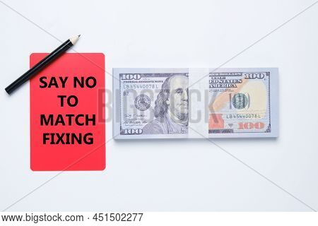 A Red Card Written Say No To Match Fixing And Fake Dollar Insight. War Against Match Fixing Concept.