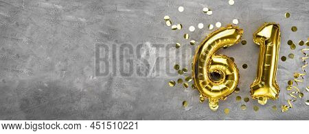 Yellow Foil Balloon Number, Number Sixty One On A Concrete Background. Greeting Card With The Inscri