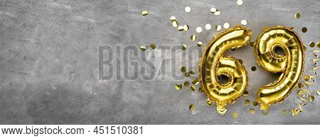 Yellow Foil Balloon Number, Number Sixty Nine On A Concrete Background. Greeting Card With The Inscr