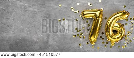 Yellow Foil Balloon Number, Number Seventy Six On A Concrete Background. Greeting Card With The Insc