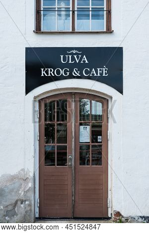 Ulva, Uppland - Sweden - 07 29 2019 Wooden Entrance Door And Facade Of The Ulva Kvarn Krog And Cafe