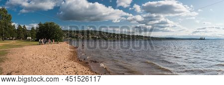 Rattvik, Dalarna - Sweden - 08 05 2019: Group Of Young People At A Camping On The Sandy Beach Of  Th