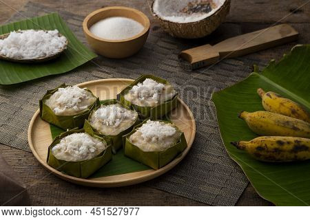 Steamed Banana With Coconut Cake And Topping With Shredded Coconut (kanom Kluay),thai Dessert