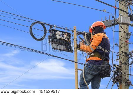 Technician On Wooden Ladder Using Smartphone To Check Data Numbers Of Cable Lines While Installing F