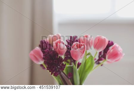 pink tulip bouquet in daylight. Spring stll life, birthday, Easter concept.