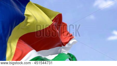 Detail Of The National Flag Of Seychelles Waving In The Wind On A Clear Day. Seychelles Is An Archip