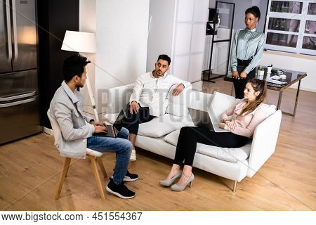 Young Diverse People Using Laptops In Coworking Space