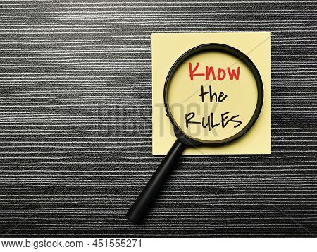 Top View Image Of Sticky Note Written Know The Rules With Magnifying Glass.
