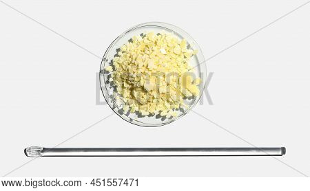 Closeup Chemical Ingredient On White Laboratory Table. Sodium Sulfide Flake In Chemical Watch Glass 