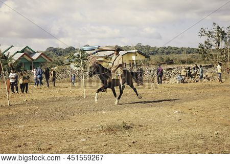 A Man Horse Rider With Tilangga Traditional Hat On Horse Ready To Race Culture From Rote Island, Eas