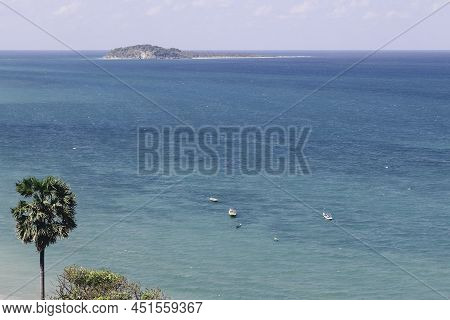 View Of Rote Tropical Beach With Deep Turquoise Blue Ocean And Small Exotic Island In The Center In