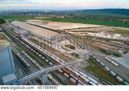 Aerial View Of Cargo Train Cars Loaded With Construction Goods At Mining Factory. Railway Transporta