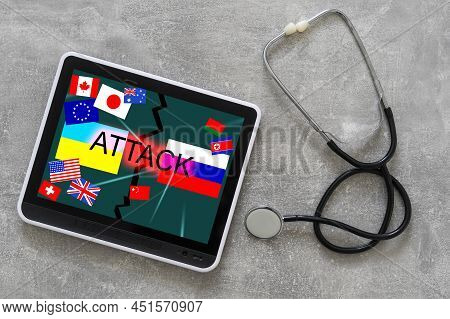 Ukrainian And Russian Flag On A Tablet And Inscription Attack.