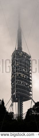 Barcelona, Spain: February 18, 2021: Panoramic View Of The Collserola Tower Entering The Clouds.