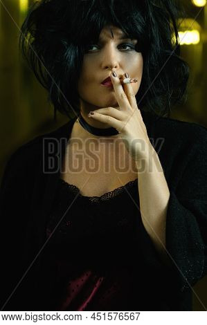 Freaky Woman With Black Hair Smoking A Cigarette