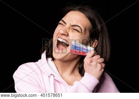 Half-legth Portrait Of Young Emotional Girl Rips Three Colors Duct Tape Off Her Mouth Isolated On Da