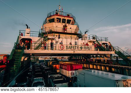Labuan,malaysia-may 7,2016:view On The Ro Ro Ferry Ship With Passengers And Vehicles At Labuan,malay